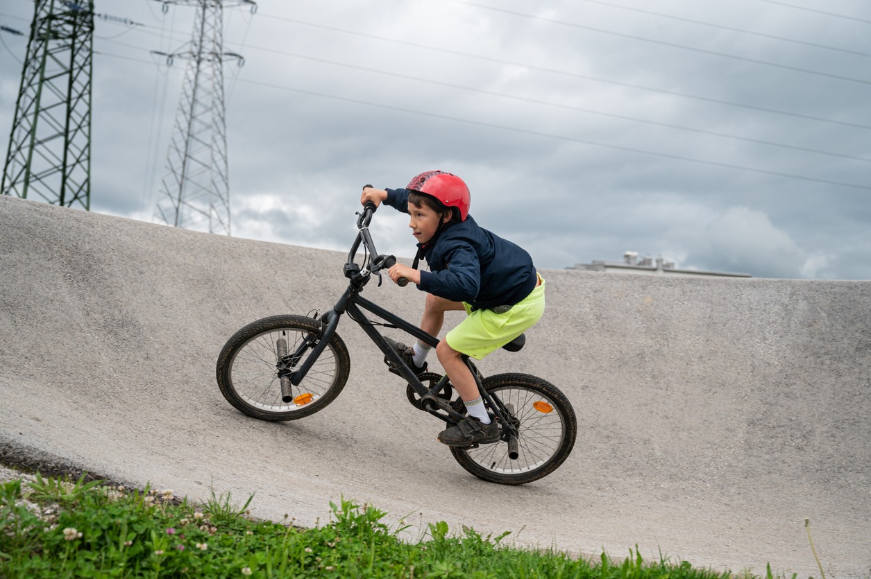 Boy riding a bike on pumptrack
