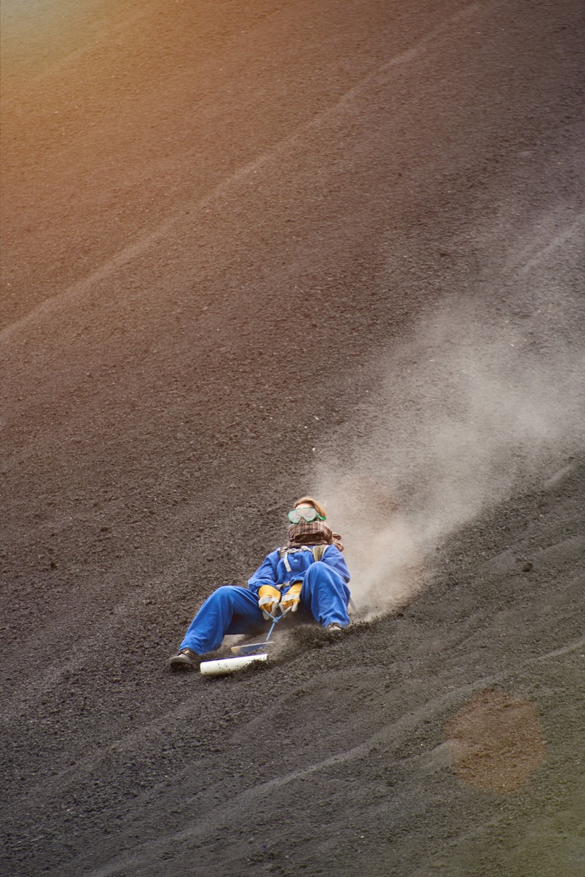 Woman on volcano sand boarding tour in Nicaragua Cerro Negro