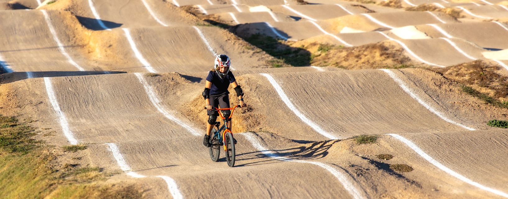 Young boy riding with bmx