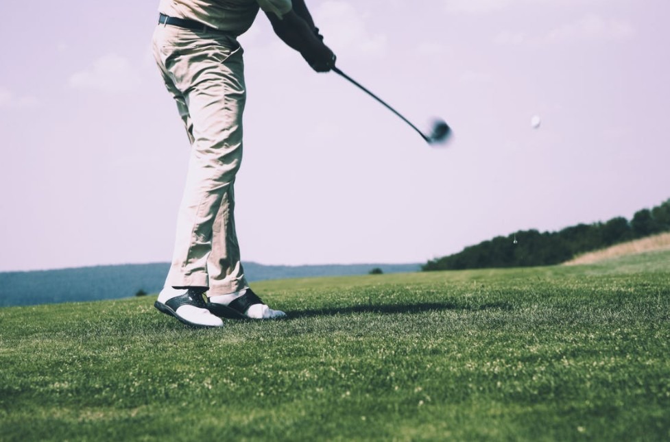 a person playing golf