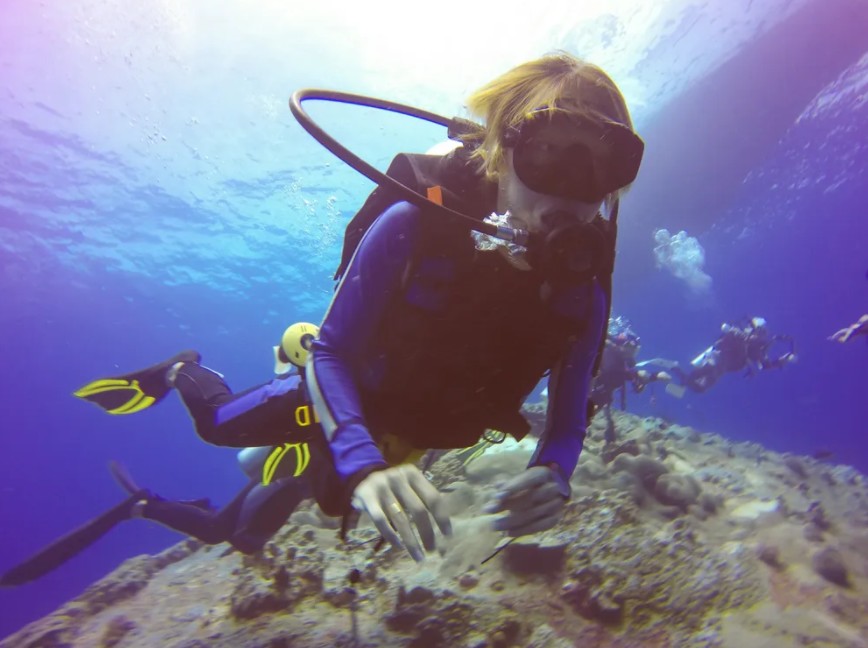 a woman scuba diving