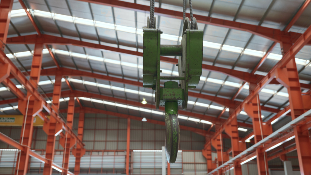 Closeup of swivel chain hook crane of electric hoist in factory workshop, pullers Swivel chain hook equipment for pullers, industry lifting machine
