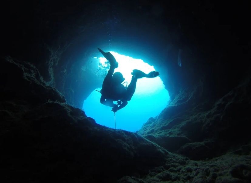a person doing cave doing