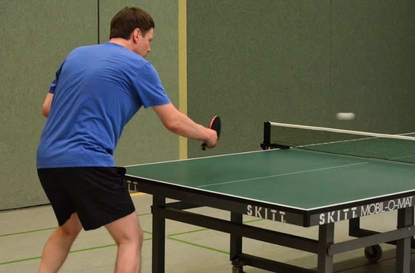 a man playing table tennis
