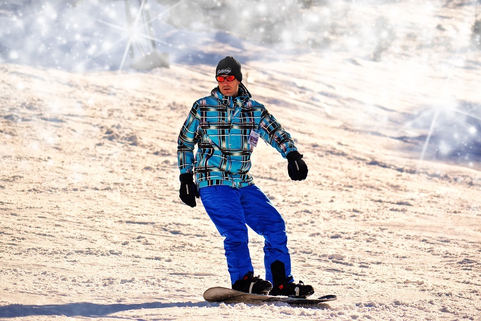Snowboarding man winter