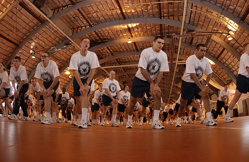 US Navy Recruits warm up before participating in the Captain's Cup sports competition